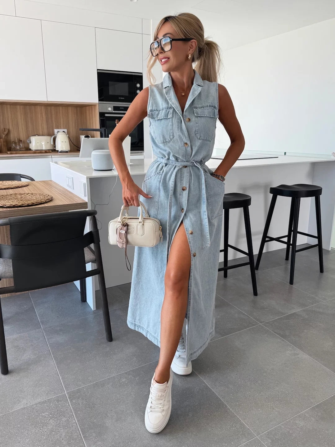 Modern sleeveless maxi dress with full button-down design