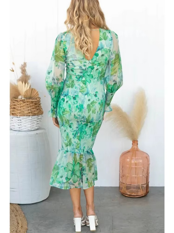 Flowy midi dress with long sleeves and a subtle floral print for an elegant look