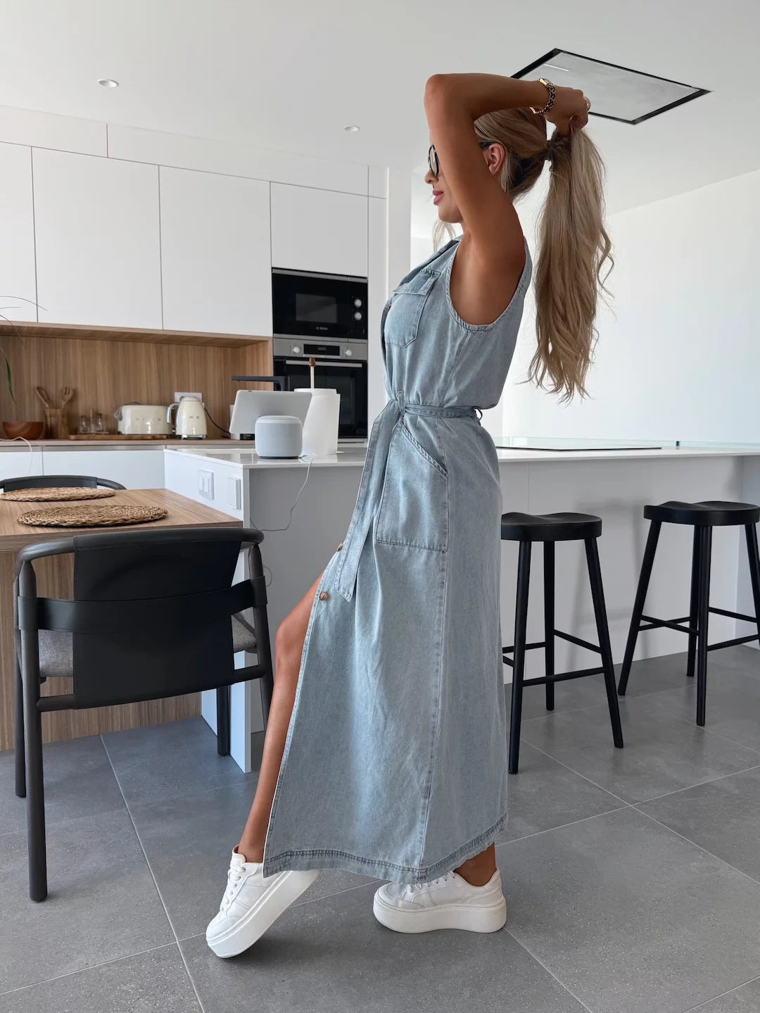 Modern sleeveless maxi dress with full button-down design