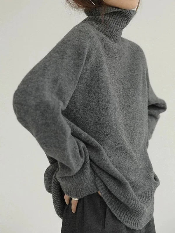 Elegant oversized sweater with long sleeves and a high neck