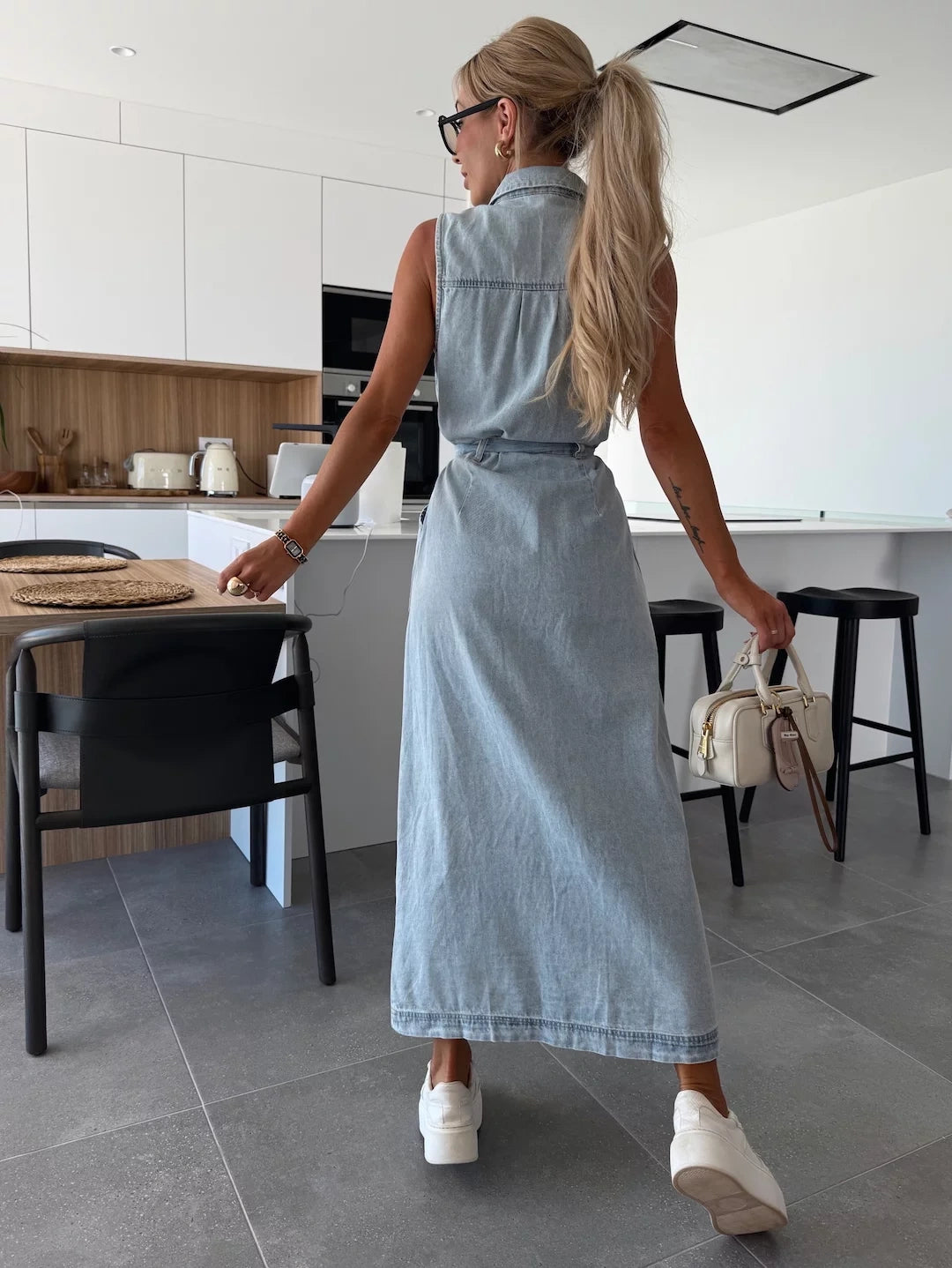 Modern sleeveless maxi dress with full button-down design