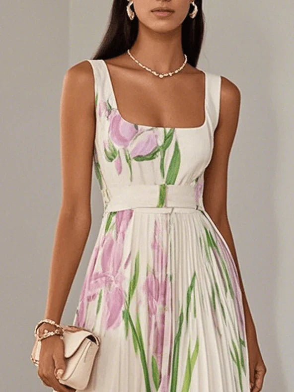 Elegant long dress with straps, pleated skirt and delicate floral print