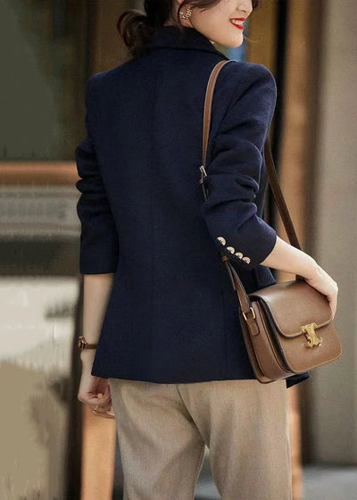 Loose-fitting navy coat with notched lapels and buttons, autumn