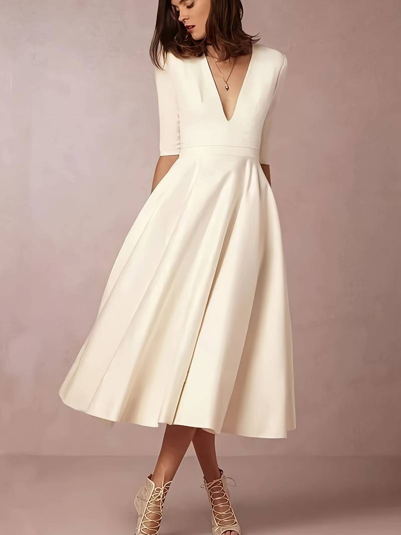 Elegant midi party dress with medium sleeves and flared cut