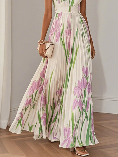 Elegant long dress with straps, pleated skirt and delicate floral print