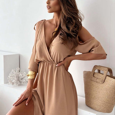 Elegant long dress with a crossover neckline and flowing side slit