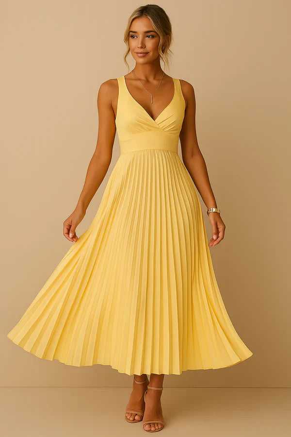 Long summer dress with a plunging neckline, open back, and elegant pleated skirt