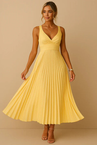 Long summer dress with a plunging neckline, open back, and elegant pleated skirt