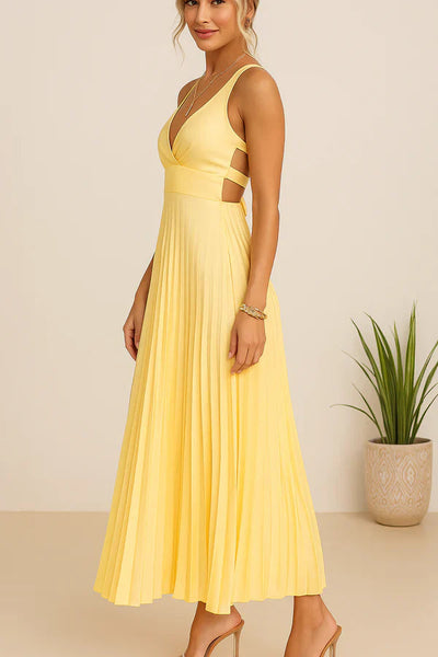 Long summer dress with a plunging neckline, open back, and elegant pleated skirt