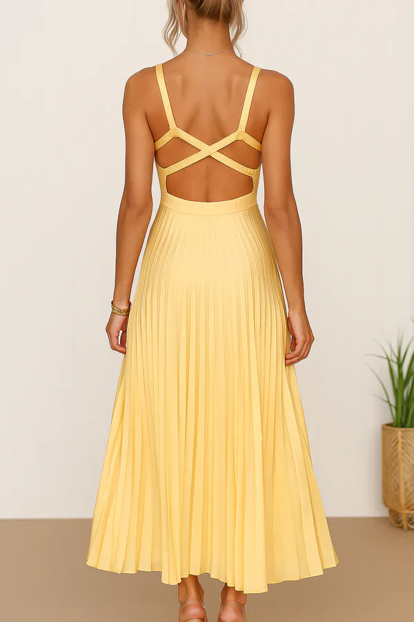 Long summer dress with a plunging neckline, open back, and elegant pleated skirt