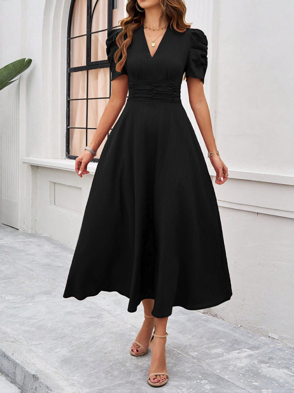 Midi cocktail dress with gathered waist, flared cut, and puff sleeves