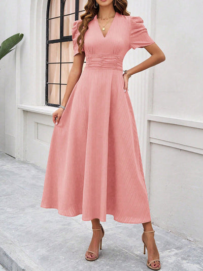Midi cocktail dress with gathered waist, flared cut, and puff sleeves