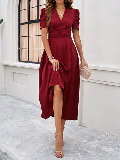 Midi cocktail dress with gathered waist, flared cut, and puff sleeves