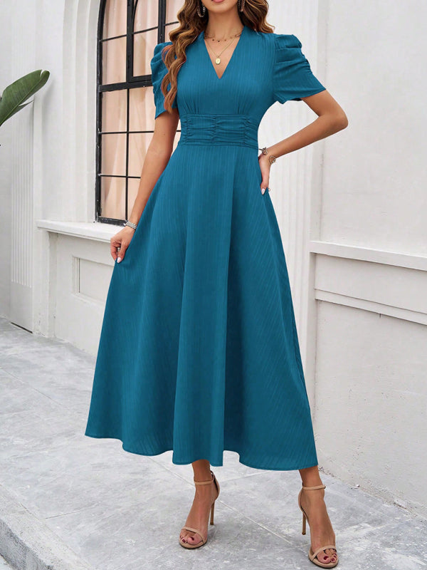 Midi cocktail dress with gathered waist, flared cut, and puff sleeves