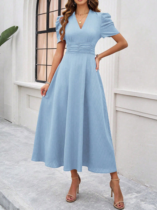 Midi cocktail dress with gathered waist, flared cut, and puff sleeves