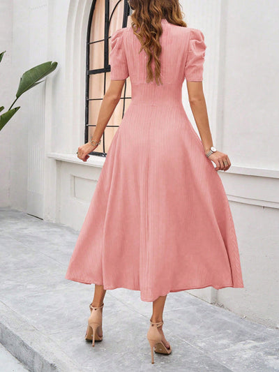 Midi cocktail dress with gathered waist, flared cut, and puff sleeves