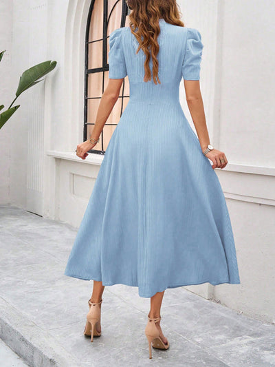 Midi cocktail dress with gathered waist, flared cut, and puff sleeves
