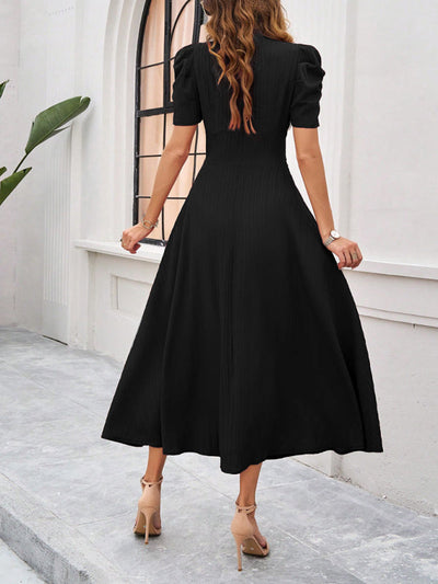 Midi cocktail dress with gathered waist, flared cut, and puff sleeves