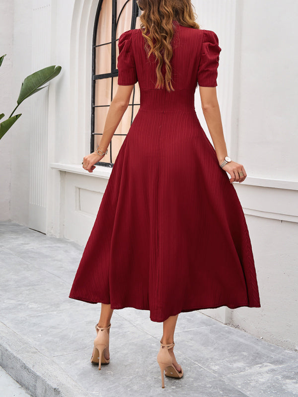 Midi cocktail dress with gathered waist, flared cut, and puff sleeves