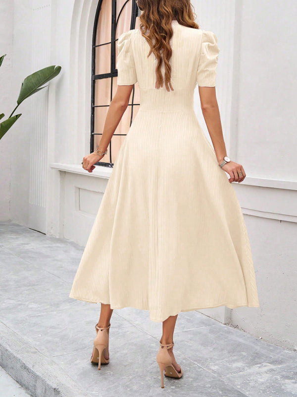 Midi cocktail dress with gathered waist, flared cut, and puff sleeves