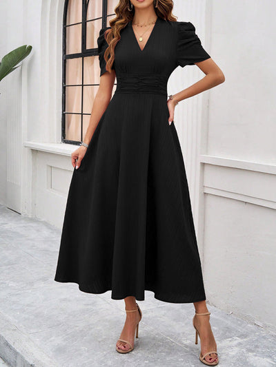 Midi cocktail dress with gathered waist, flared cut, and puff sleeves