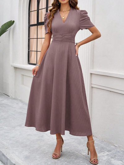 Midi cocktail dress with gathered waist, flared cut, and puff sleeves