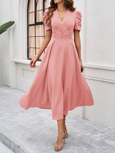 Midi cocktail dress with gathered waist, flared cut, and puff sleeves