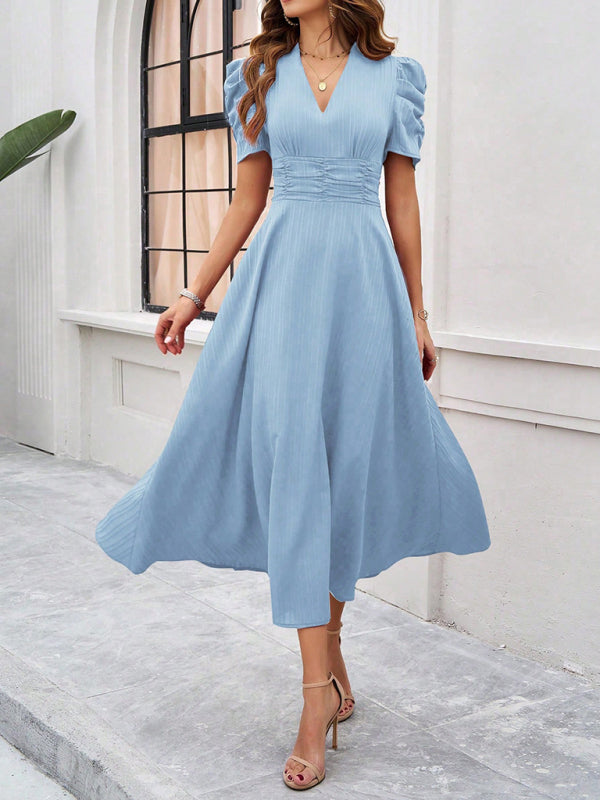 Midi cocktail dress with gathered waist, flared cut, and puff sleeves
