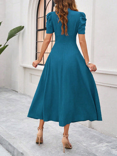 Midi cocktail dress with gathered waist, flared cut, and puff sleeves