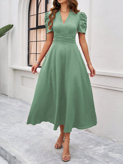 Midi cocktail dress with gathered waist, flared cut, and puff sleeves