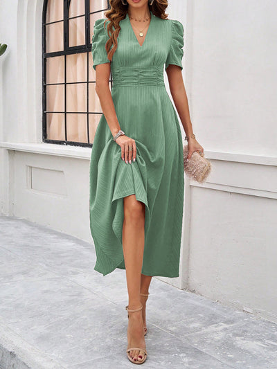 Midi cocktail dress with gathered waist, flared cut, and puff sleeves