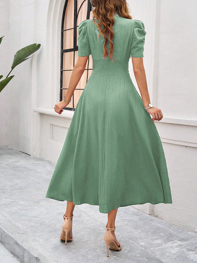 Midi cocktail dress with gathered waist, flared cut, and puff sleeves