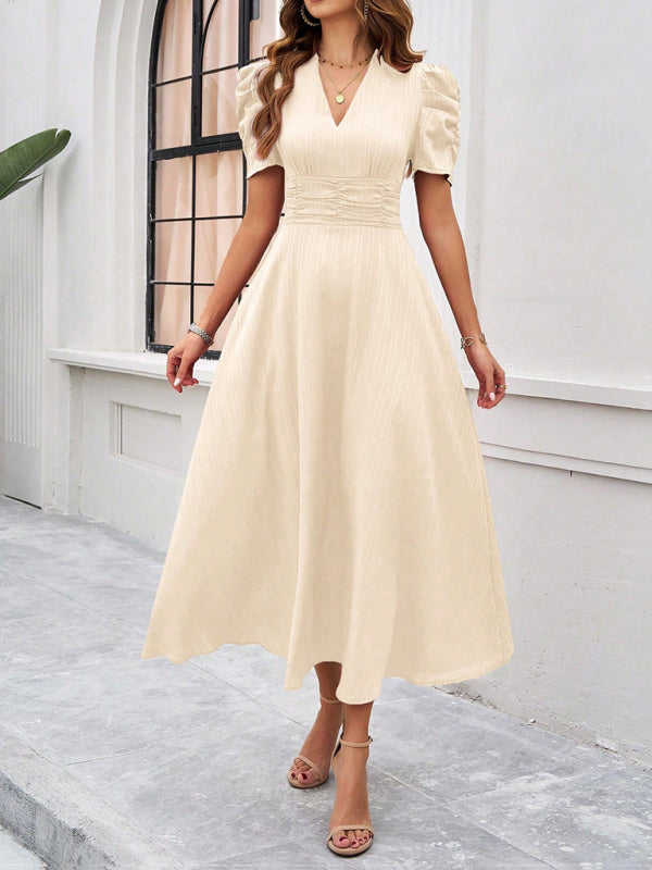 Midi cocktail dress with gathered waist, flared cut, and puff sleeves