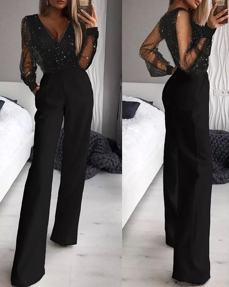Elegant women's jumpsuit with plunging neckline and shiny details, wide-legged trousers