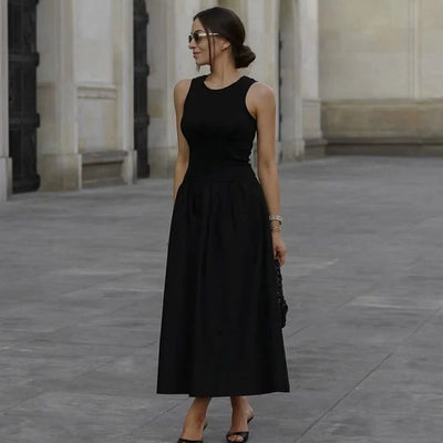 Long sleeveless casual dress with a flowing drape