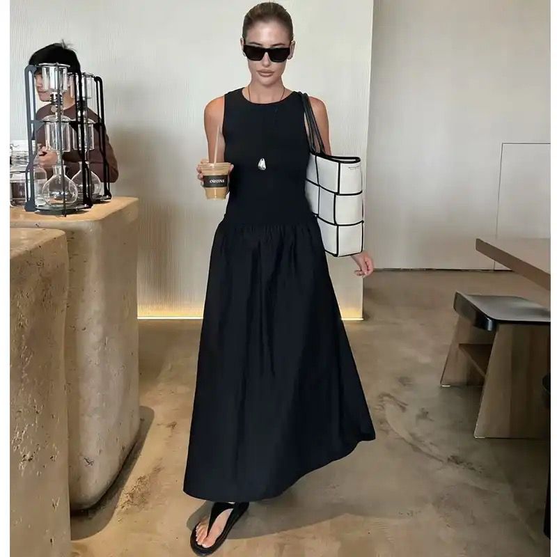 Long sleeveless casual dress with a flowing drape