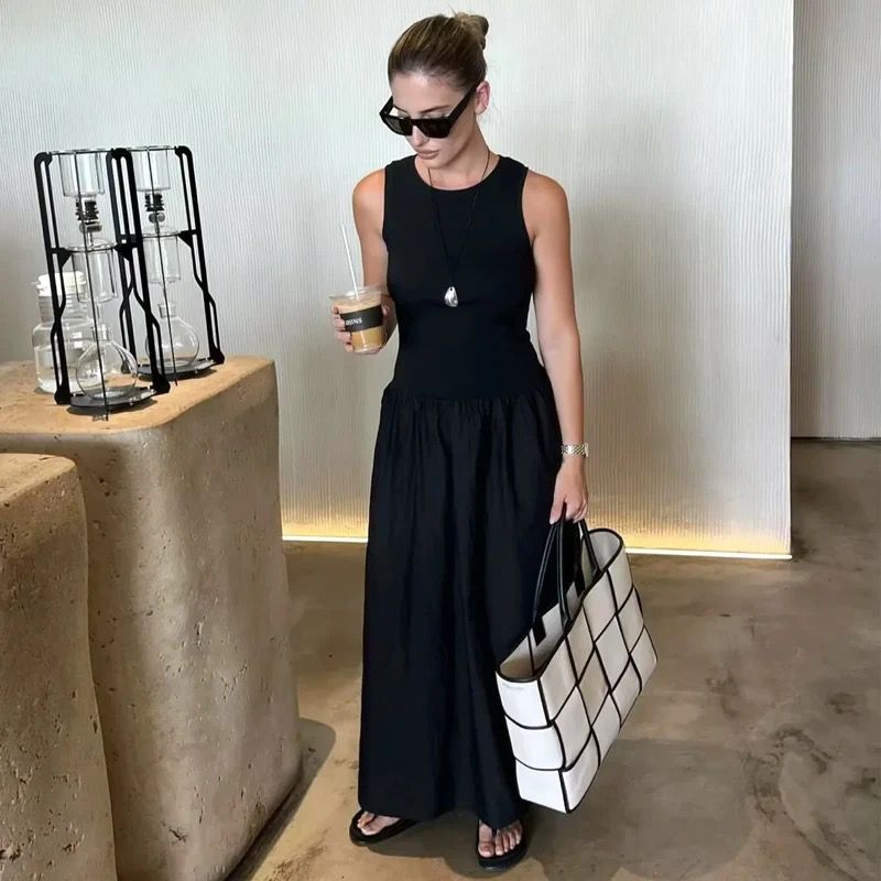 Long sleeveless casual dress with a flowing drape
