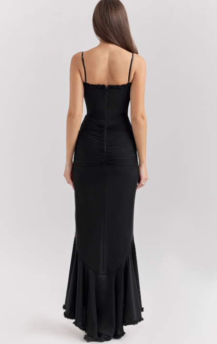 Long evening dress with thin straps and asymmetrical skirt for a sophisticated style