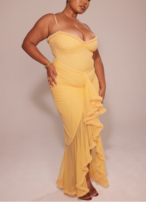 Long evening dress with thin straps and asymmetrical skirt for a sophisticated style