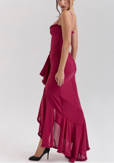 Long evening dress with thin straps and asymmetrical skirt for a sophisticated style
