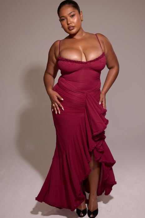 Long evening dress with thin straps and asymmetrical skirt for a sophisticated style