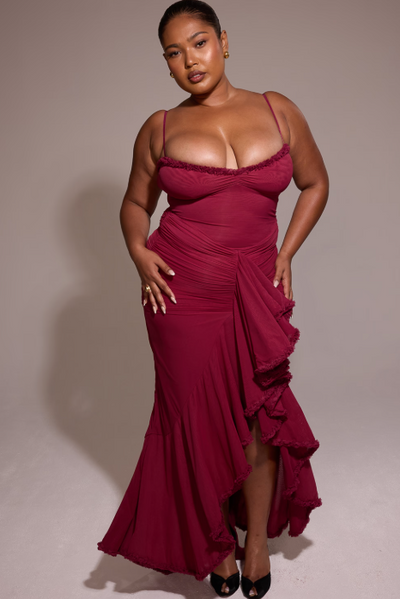 Long evening dress with thin straps and asymmetrical skirt for a sophisticated style