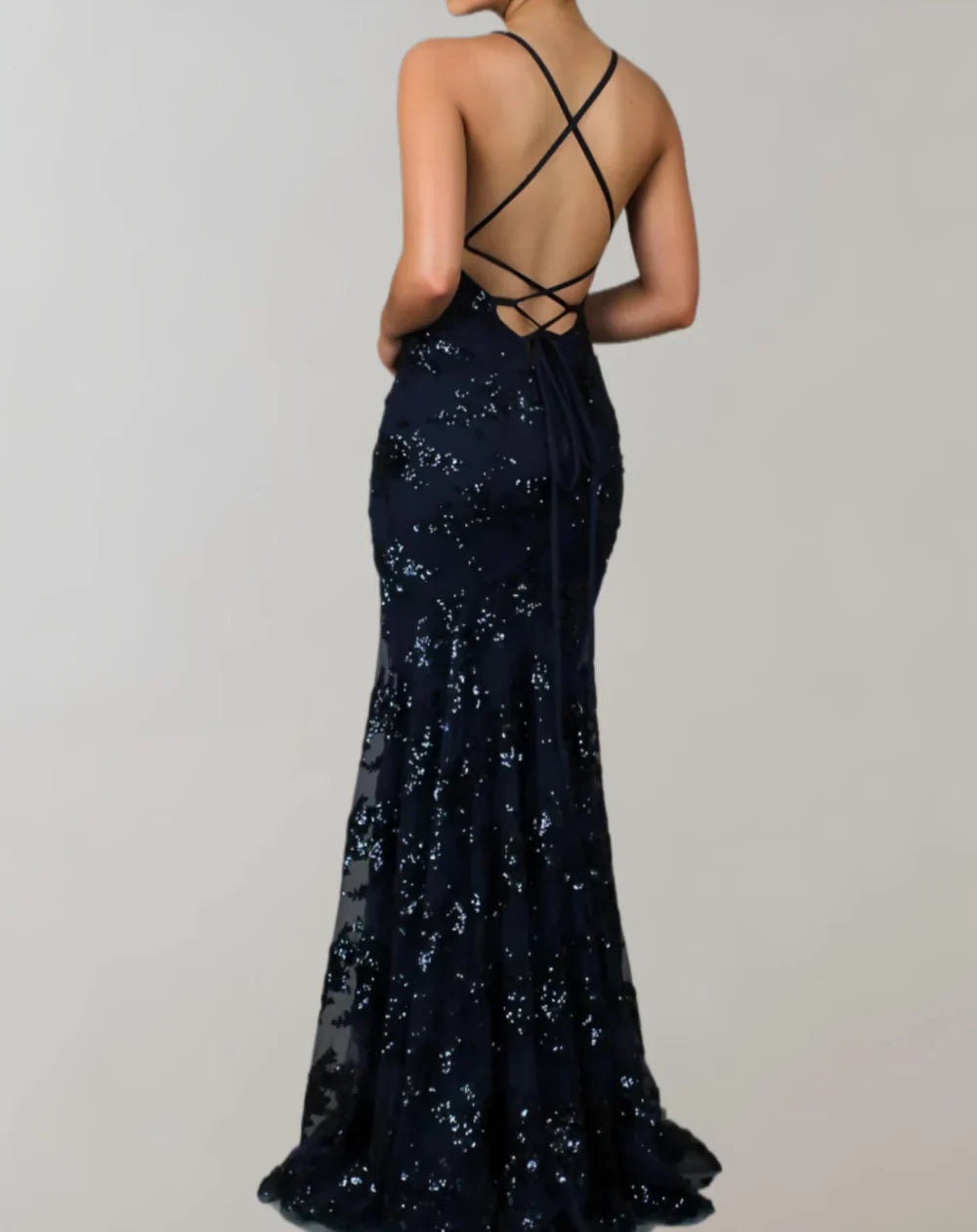 Long sleeveless shiny dress with open back