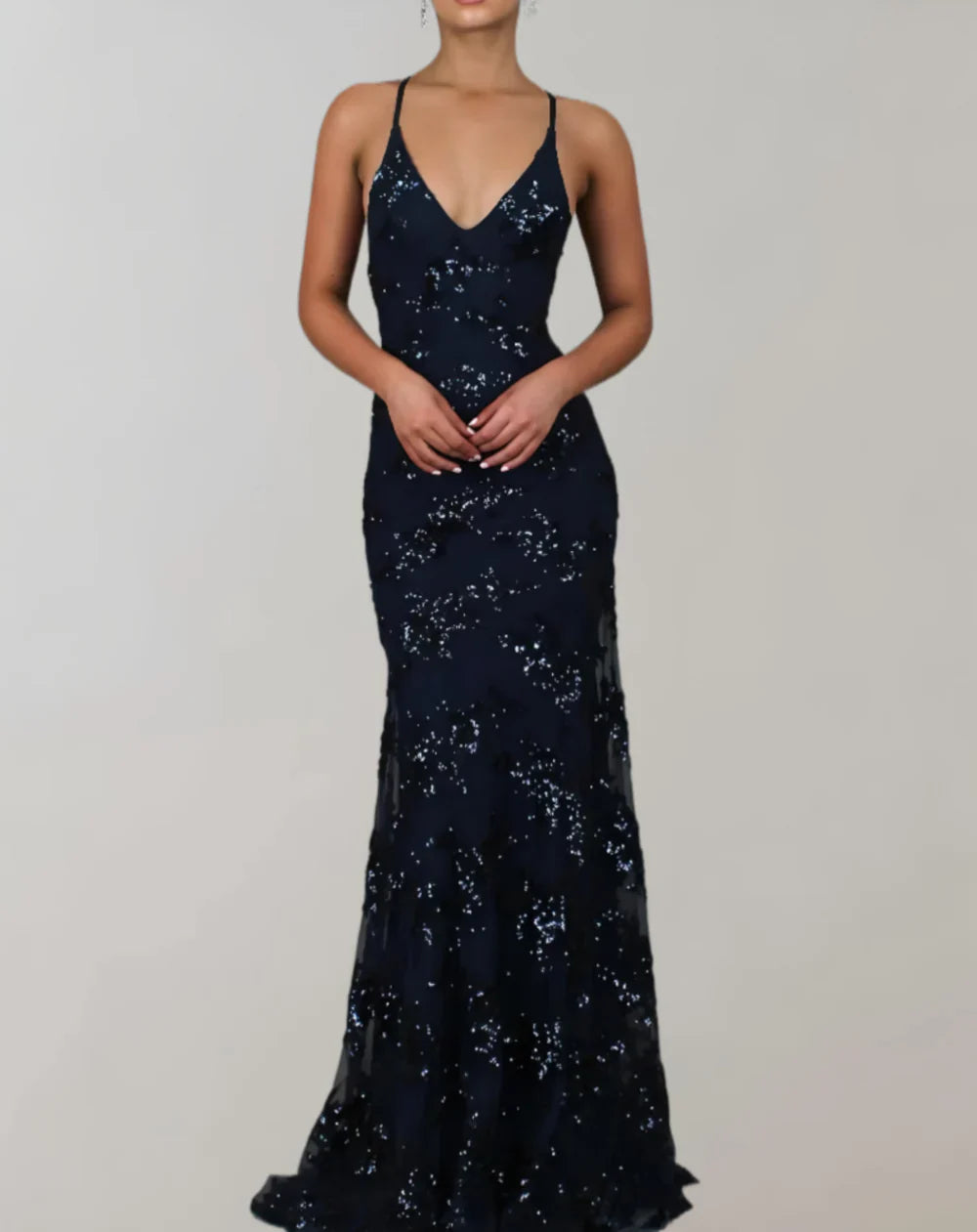 Long sleeveless shiny dress with open back