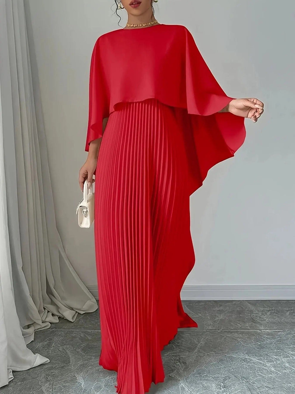 Long pleated dress with flowing detail for elegant events