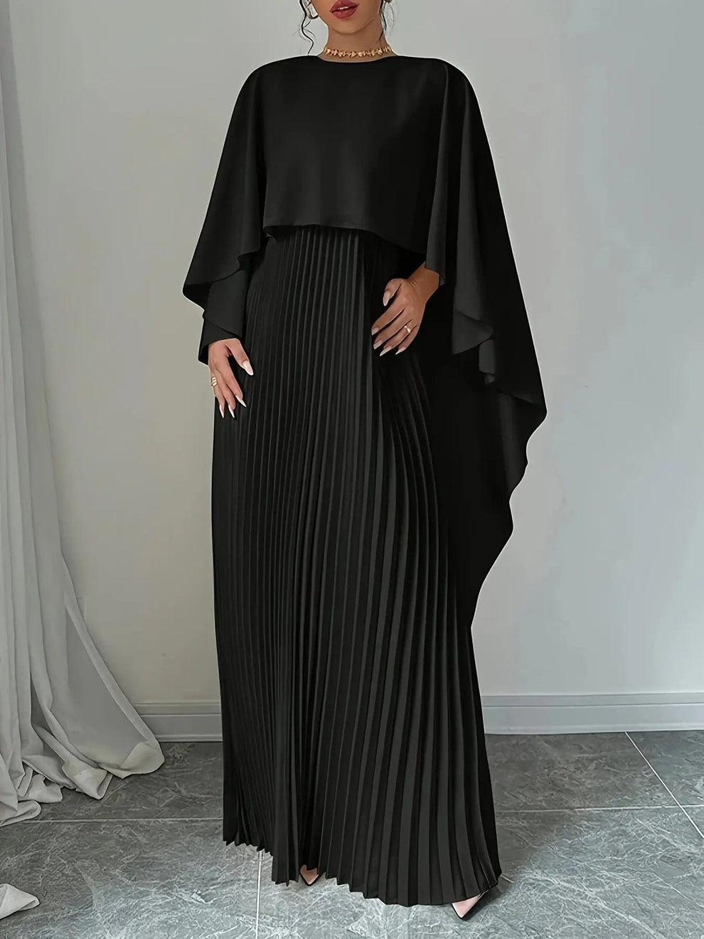 Long pleated dress with flowing detail for elegant events