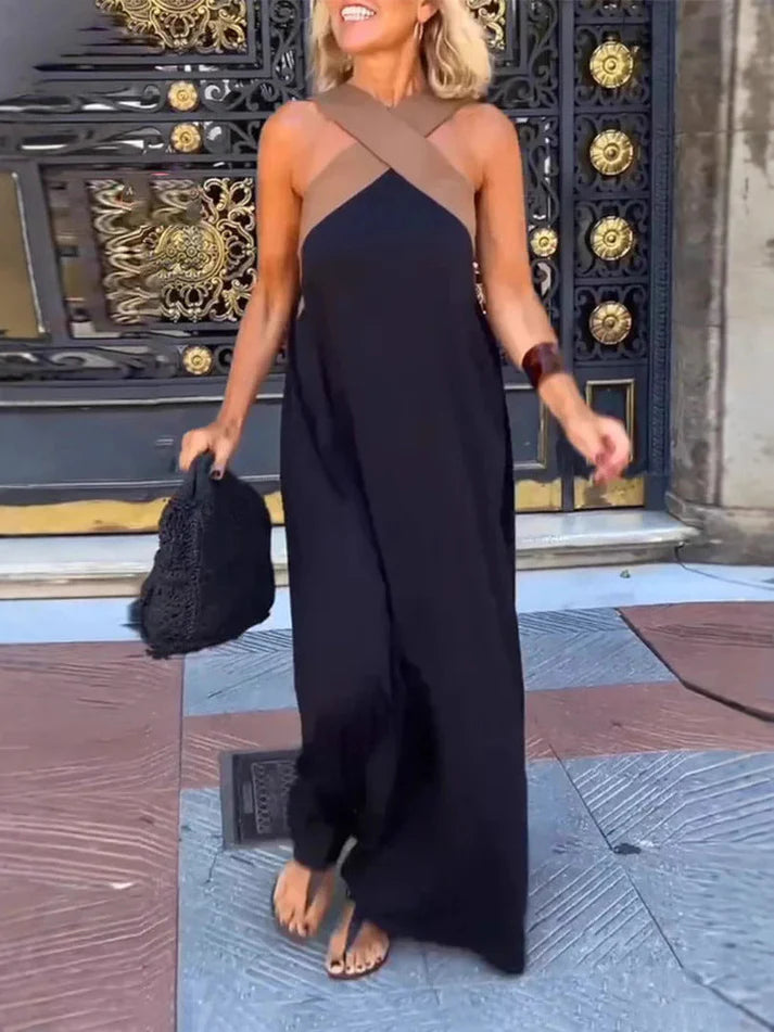 Long sleeveless dress with elegant neckline and modern cut