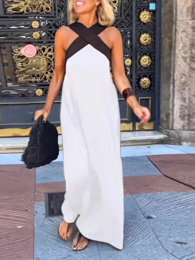 Long sleeveless dress with elegant neckline and modern cut