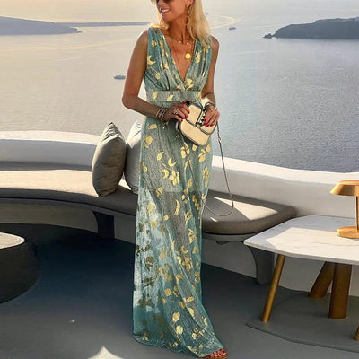 Long flowing dress with V-neckline and details with shiny elements