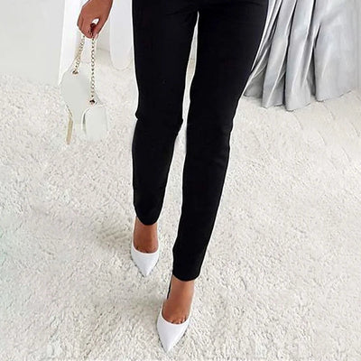 Elegant women's jumpsuit with sophisticated design and shiny sleeves